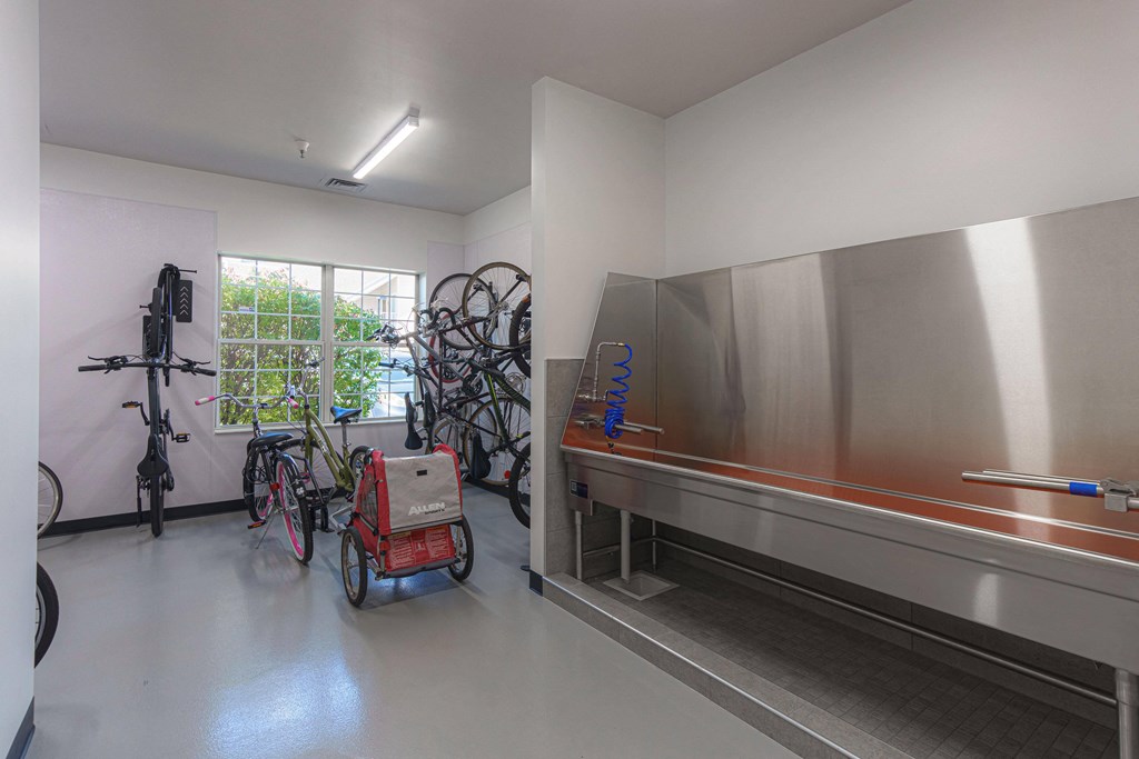a room with a stove and bikes in the corner